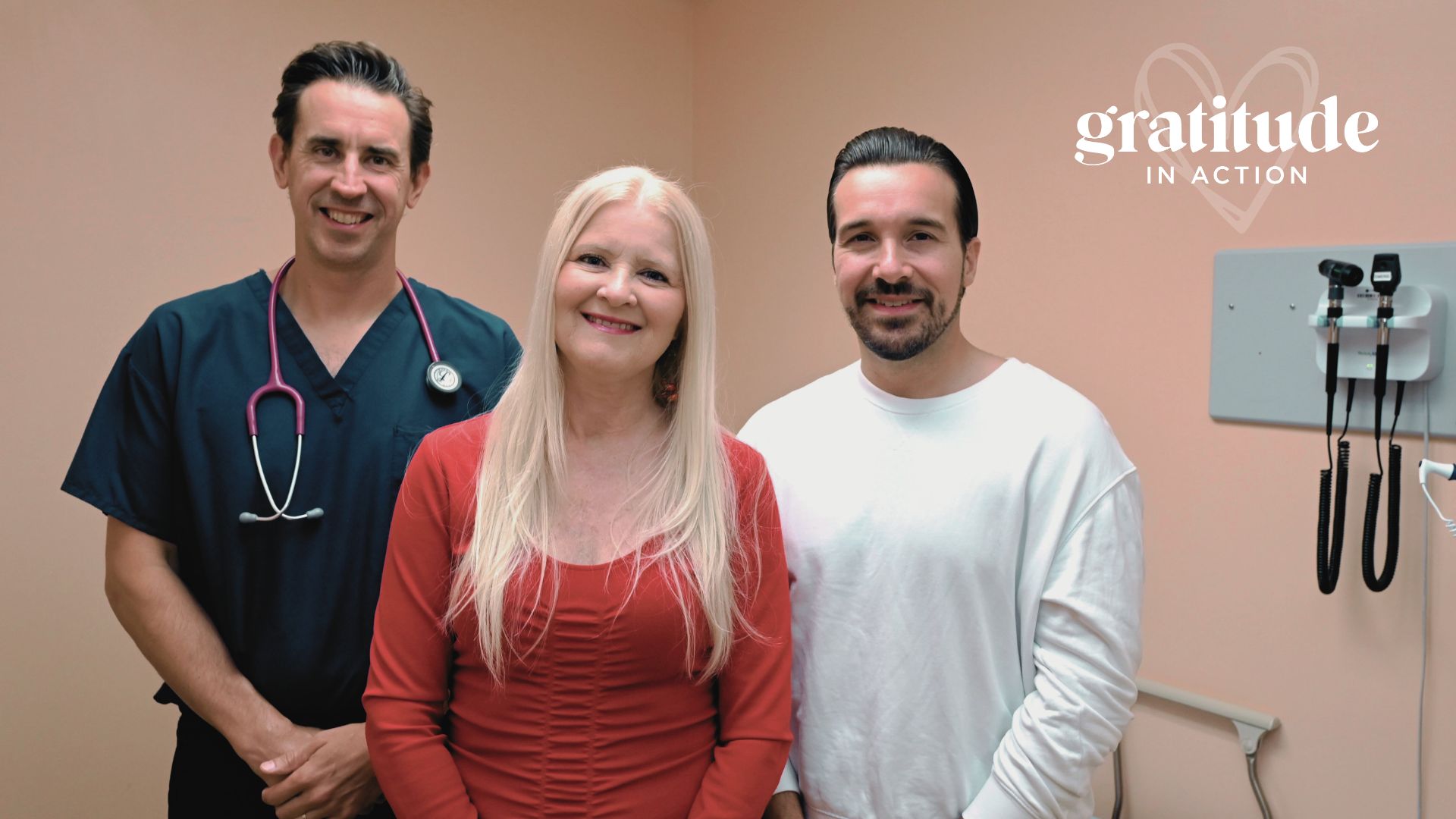 Dr Bonta, Patient Judi Dosne and Dr. Randazz stand in hospital room smiling.